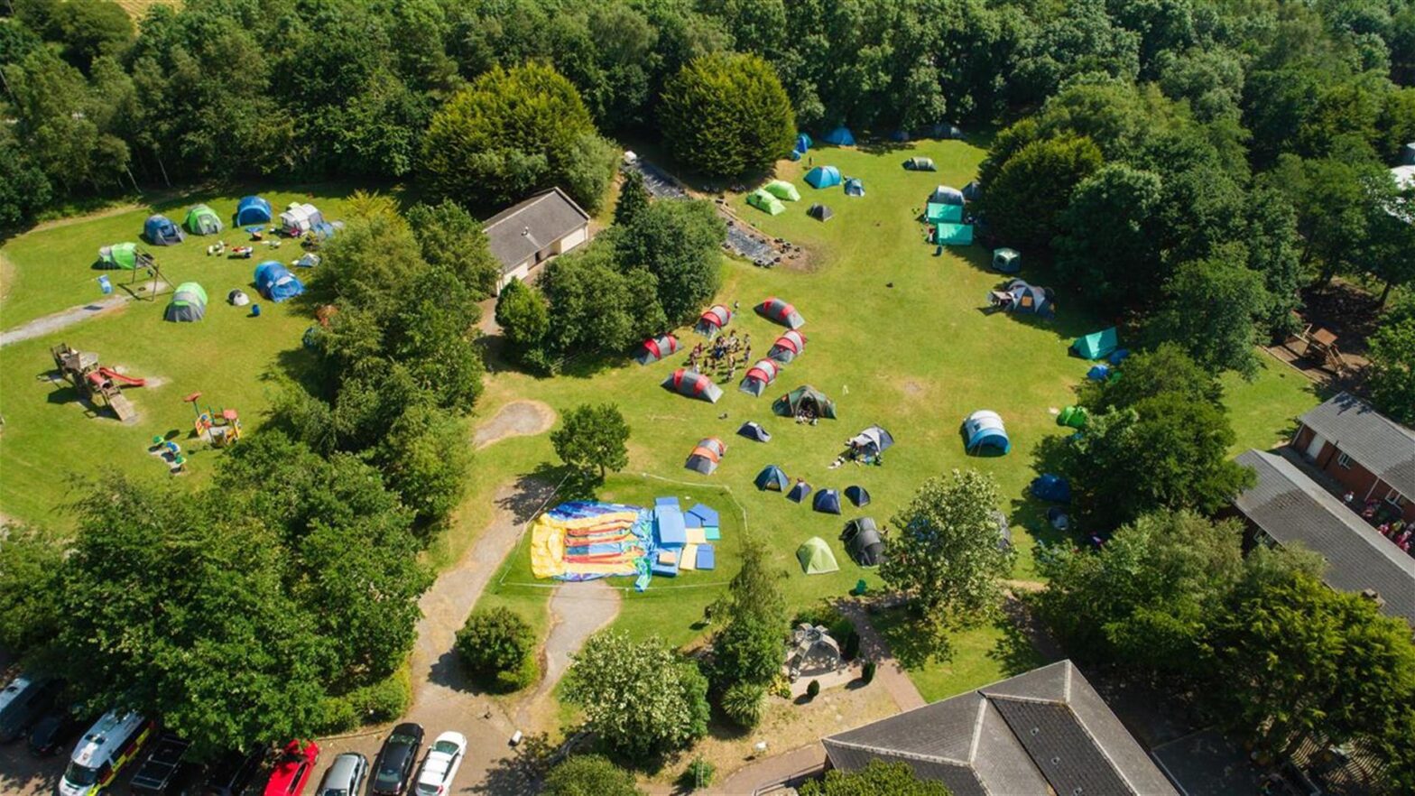 Aerial view of Share Discovery Village outdoor activity centre with camping tents and green grounds in County Fermanagh