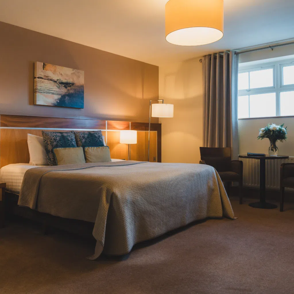 Comfortable double bedroom at the Westville Hotel with modern furnishings and soft lighting