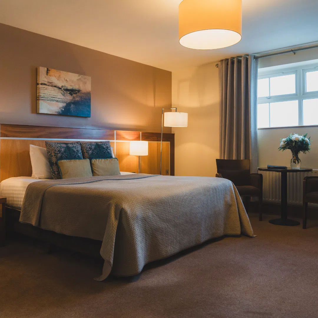 Comfortable double bedroom at the Westville Hotel with modern furnishings and soft lighting