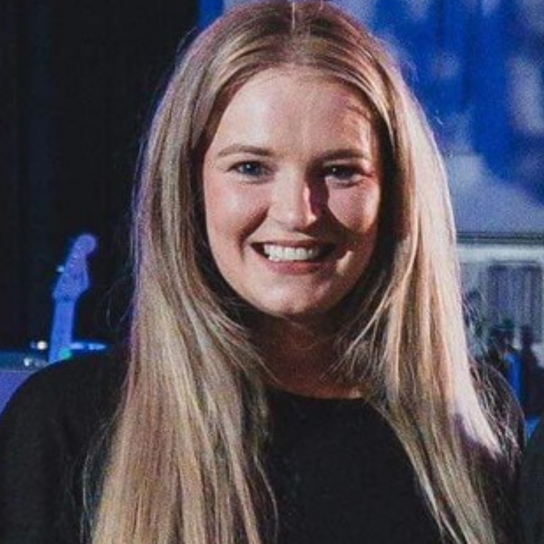 Portrait of Leah Phillips smiling during a live performance or event appearance
