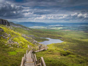 Cuilcagh Boardwalk Trail in County Fermanagh with scenic mountain views.