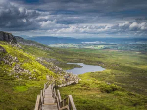 Cuilcagh Boardwalk Trail in County Fermanagh with scenic mountain views.