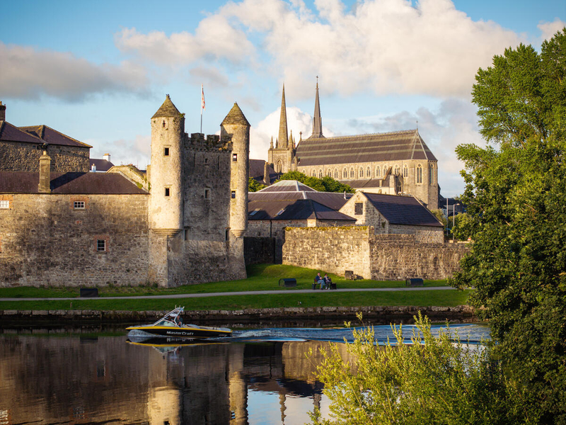 Enniskillen Castle in Fermanagh with a speed boat on the water