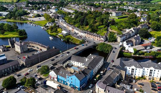 Aerial view of Enniskillen town centre with bridges, waterways and historic buildings between Upper and Lower Lough Erne