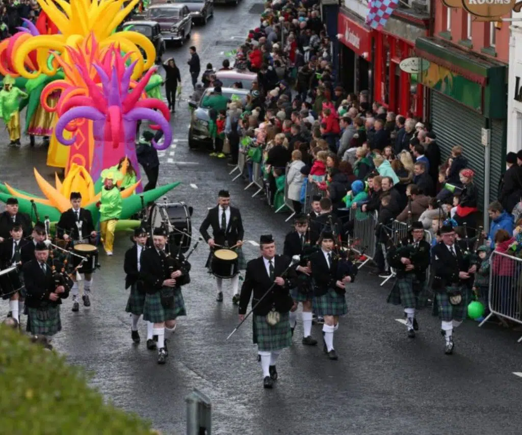 St Patrick’s Day parade with marching band and festival crowds in Enniskillen town centre, County Fermanagh.