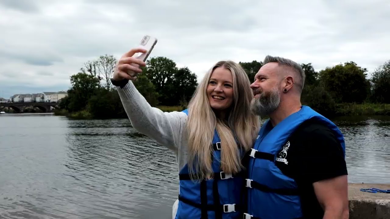 Couple enjoying a boating experience near Enniskillen on Lough Erne as part of a stay and explore visit at The Westville Hotel.