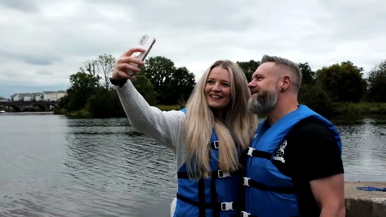 Couple enjoying a boating experience near Enniskillen on Lough Erne as part of a stay and explore visit at The Westville Hotel.